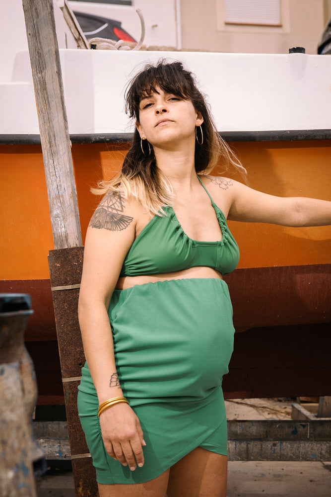 jupe verte de grossesse et de maternité Naissance publique